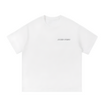White streetwear tee with small EXCEED Studios logo on chest minimal padel streetwear design 