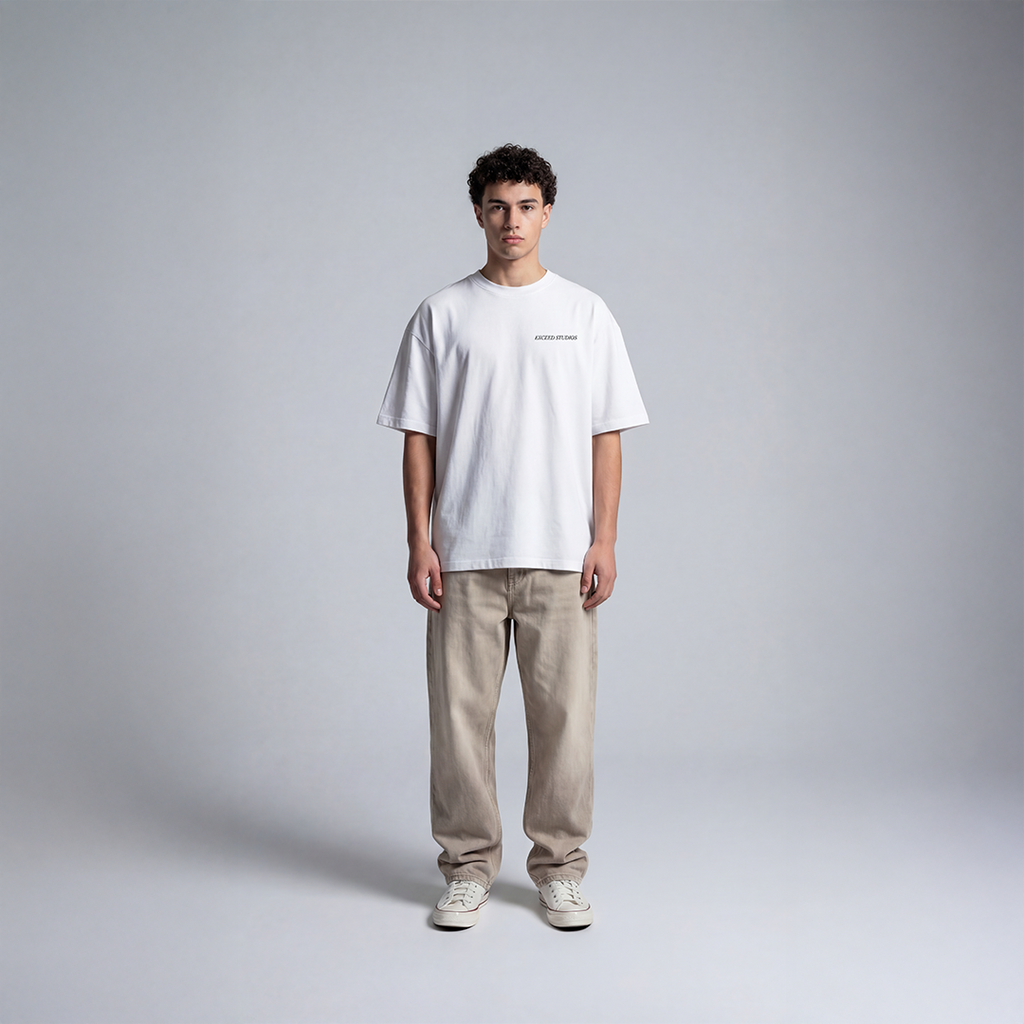 White streetwear tee with small EXCEED Studios logo on chest minimal padel streetwear design 
