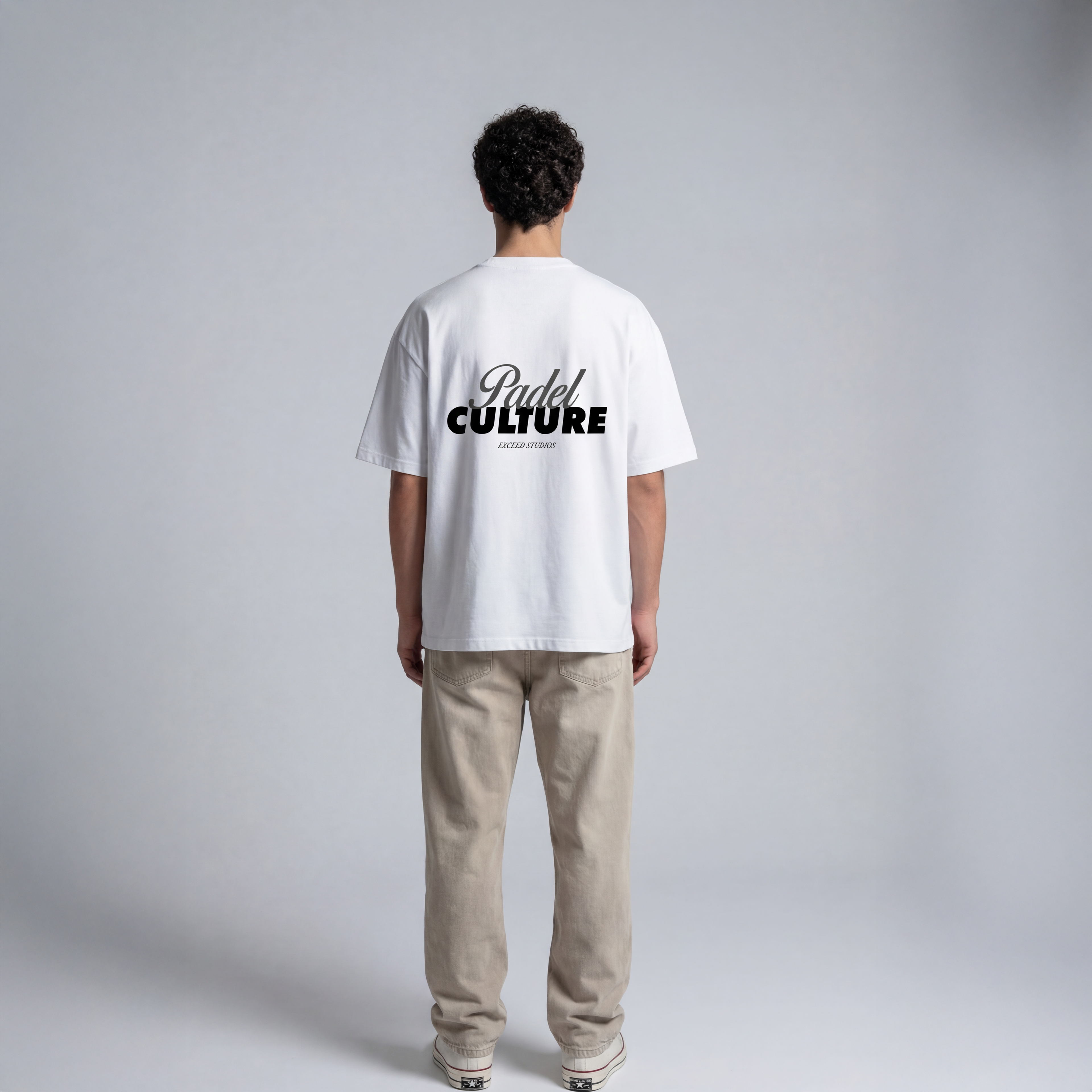 White padel streetwear tee with Padel Culture graphic text on back and EXCEED Studios branding